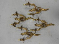 Lot 166 - A set of four gilt metal rococo style two...