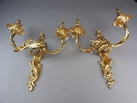 Lot 167 - A pair of rococo style gilt metal two branch...