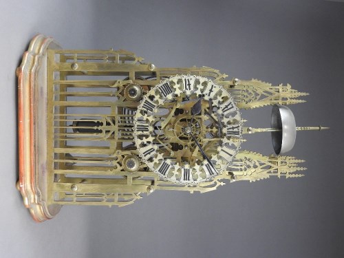 Lot 185 - A late 19th-century skeleton clock in the form...