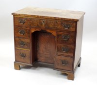 Lot 211 - A mahogany and walnut veneered knee-hole...