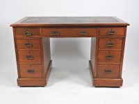 Lot 250 - A late Victorian walnut pedestal kneehole desk,...