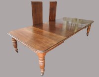 Lot 274 - A Victorian oak extending dining table mid...