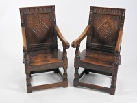 Lot 282 - A pair of children's oak panel back chairs,...