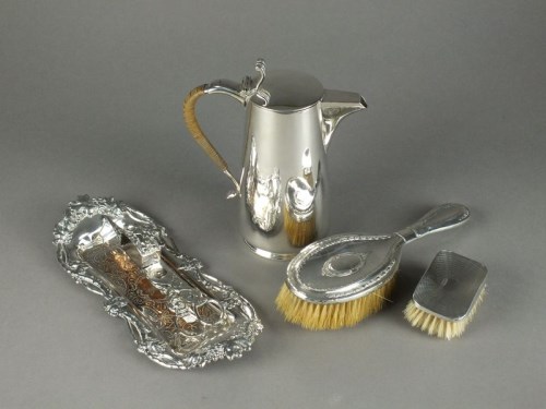 Lot 27 - A silver mounted hair brush, together with a...