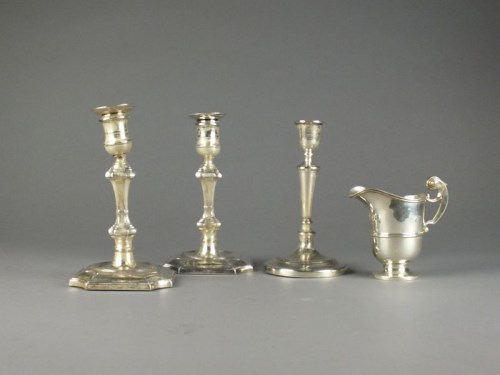 Lot 29 - A pair of silver mounted candlesticks,...