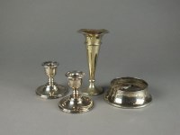Lot 32 - A pair of short silver mounted candlesticks,...