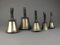 Lot 91 - A set of seventeen hand bells with leather...