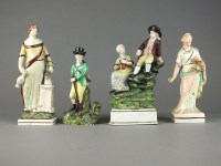 Lot 154 - A group of Staffordshire pearlware figures,...