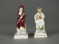 Lot 157 - A pair of Staffordshire figures, early 19th...