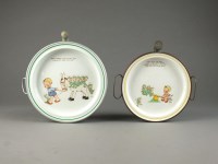 Lot 180 - Two Shelley baby warming plates designed by...