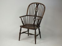 Lot 316 - An elm seat wheel and stick back Windsor chair,...