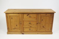 Lot 364 - A modern pine dresser base, the rectangular...