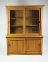 Lot 365 - A modern light oak wall unit the ogive stepped...