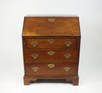 Lot 366 - A George III mahogany bureau, the fall front...