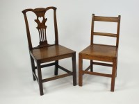 Lot 404 - A pair of George III oak panel seat dining...