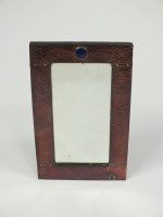 Lot 407 - An Arts and Crafts mirror, the rectangular...